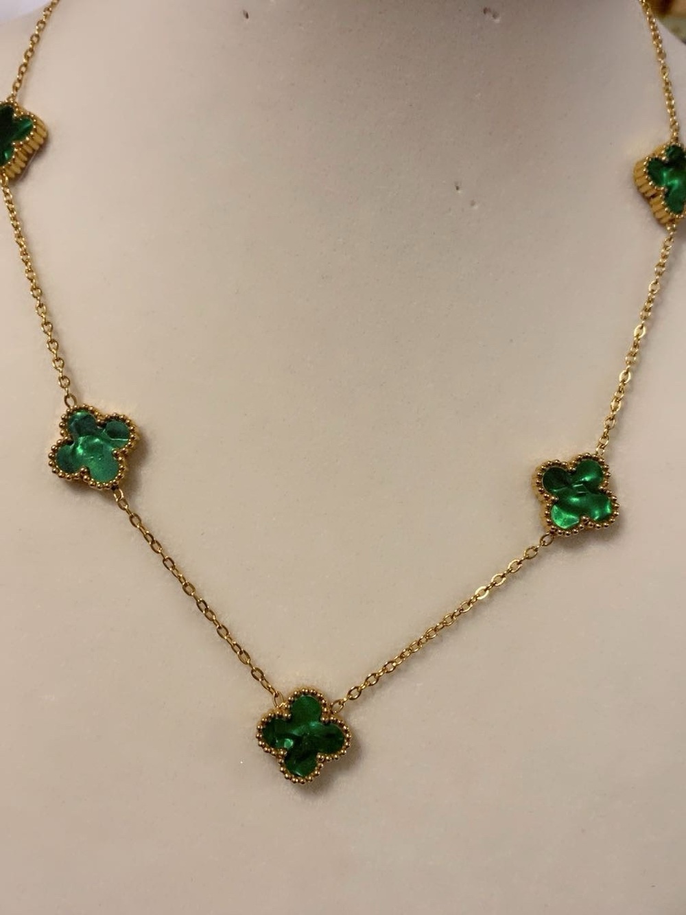 Gold-Tone Necklace with Emerald Green Clover Accents stainless steel